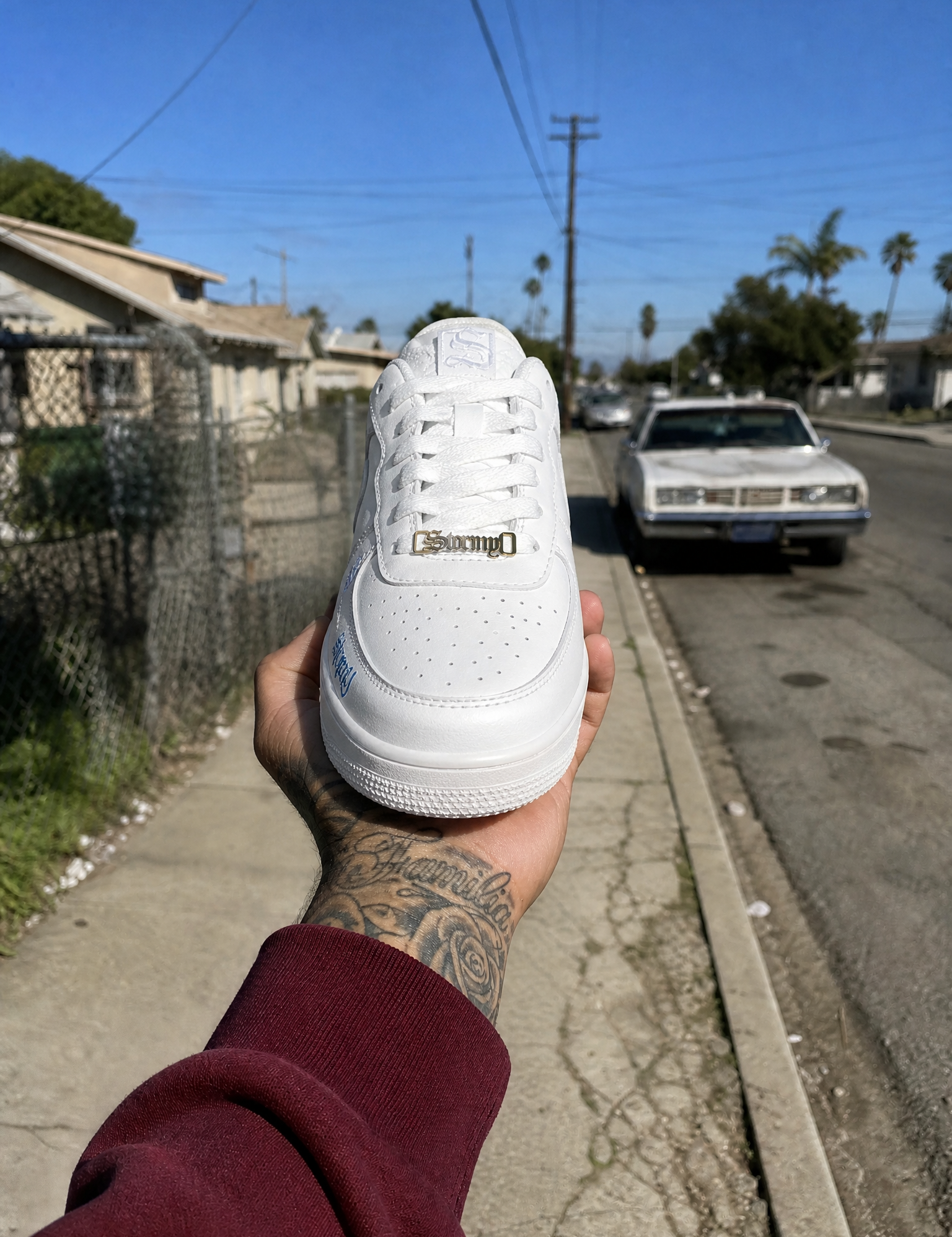 GeneratedwithKive.ai-WhiteleathersneakerUsetheprovidedreferenceimageasthecompositionreferenceforthescene.Preservetheexactsamehand_handposition_grip_wristangle_braceletplacement__3.png